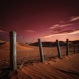 Boots by the Fence